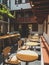 Toned image of modern interior with wooden furniture and big windows at cafeteria