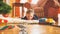 Toned image of smiling little boy playing on wooden floor with his new toy train and railroad. Child receiving presents