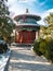 Toned image of traditional Chinese pavilion standing in Beijing near the Forbidden City in the winter against the blue sky with cl