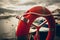 Toned photo of lifebuoy at rainy weather in seaport