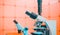 Toned photo of scientific trinocular microscope with camera in science laboratory