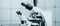 Toned photo of scientific trinocular microscope with camera in science laboratory