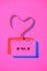 toned pink picture of retro audio cassette with tape in heart shape