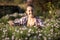 Toned portrait of woman working at garden and cutting flowers