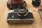Toned shot of retro camera with portrait lens lying on wooden de