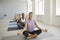 Toned sporty women train practice yoga in gym