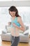 Toned woman measuring chest in fitness studio