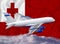 Tonga flag with white airplane and clouds. The concept of tourist international passenger transportation