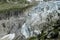 The tongue of the glacier descends to alpine valley