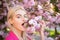 Tongue and lick. Close up portrait of spring girls in flowers.