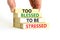 Too blessed to be stressed symbol. Concept words Too blessed to be stressed on wooden blocks. Beautiful white table white