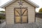 Tool shed with worn out wood outline and star decor creating a rustic design