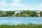 Toolo Bay in City Park, Helsinki, Finland. Across the water, rides at Linnamaki amusement park can be seen above the trees