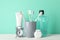 Tools for dental care on mint background