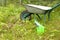 Tools for gardening. Rake, watering can and wheelbarrow