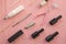 Tools for manicure on pink background. Gel nail procedure equipment concept.