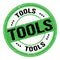 TOOLS text written on green-black round stamp sign