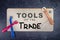 Tools of the trade message sign with sewing crafting tools flat lay