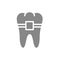 Tooth with braces gray icon. Orthodontic treatment symbol.