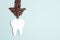 Tooth and coffee bean arrow. Coffee spoils teeth and makes them yellow. Dental care concept. Flat lay, copy space
