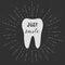 Tooth. Just smile. Vector. White tooth on black background. Vintage retro sunburst, grunge background.