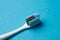 Toothbrush on blue background, close-up