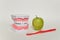 Toothbrush and green apple, dental care concept