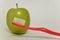 Toothbrush and green apple, dental care concept