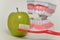 Toothbrush and green apple, dental care concept