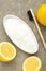 Toothbrush with lemon and baking soda on grey background. Vertical photo