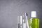 Toothbrush, mouthwash and glass of water on a gray background close-up with a place for text