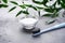 Toothbrush and tooth powder on a gray background