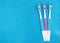 Toothbrushes on a blue glitter background