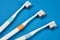 Toothbrushes on empty blue background