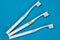 Toothbrushes on empty blue background