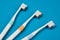 Toothbrushes on empty blue background