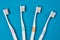 Toothbrushes on empty blue background