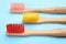 Toothbrushes made of bamboo on light background, closeup