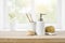 Toothbrushes, soap dispenser and skin care sponges on wooden table