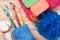 Toothbrushes, soap, sponge, towel on a wooden table. hygiene products. Top view