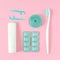 Toothbrushes, toothpaste, and chewing gum set on pink background.