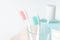 Toothbrushes, toothpaste, rinse and towel on white background.