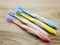 toothbrushes on wooden background with space copy