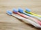 Toothbrushes on wooden background with space copy