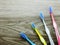 Toothbrushes on wooden background with space copy