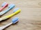 Toothbrushes on wooden background with space copy