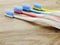 Toothbrushes on wooden background with space copy