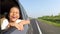 Toothless girl enjoying fresh air on car windows