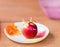 Toothpicks stab into red apple