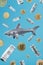A toothy shark is hunting for money around dollars and bitcoins on a blue background